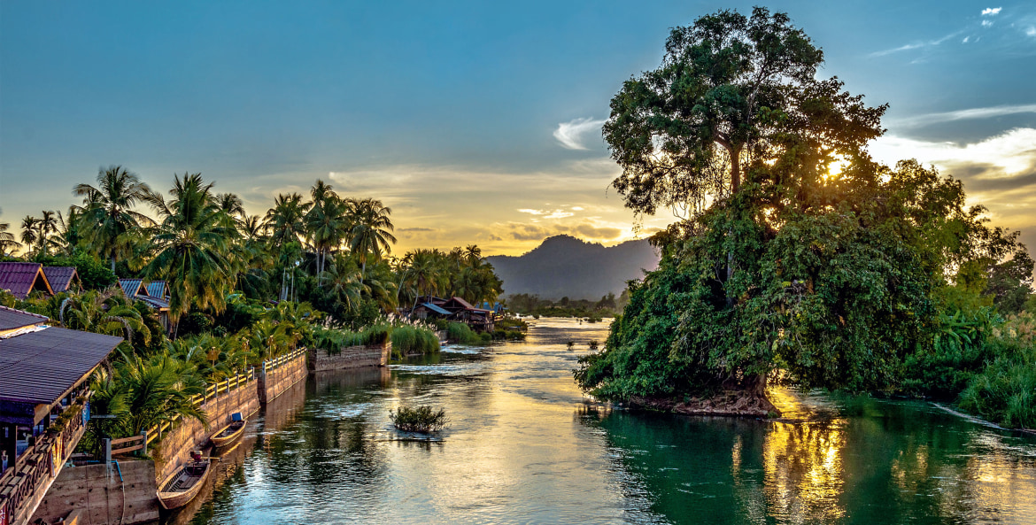The Mekong River flows serenely through the Si Phan Don (4,000 Islands) in Laos, image
