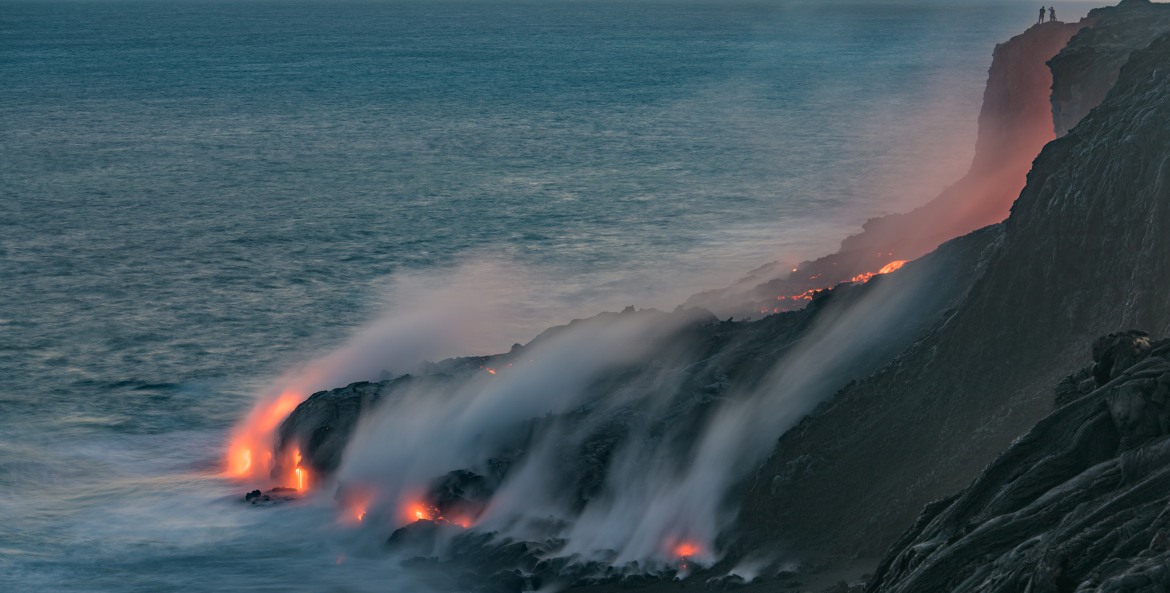 lava spills into the ocean at Kalapana, an old fishing village east of Hawaii Volcanoes National Park on the Big Island, picture