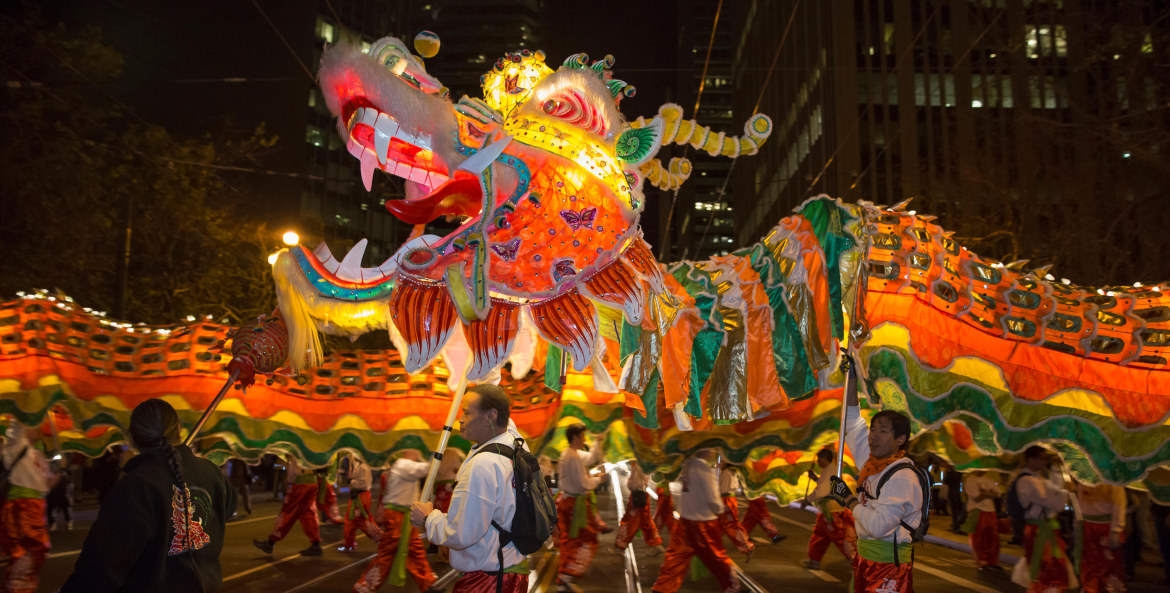 dragon with escorts in Chinese New Year parade at night in San Francisco, picture