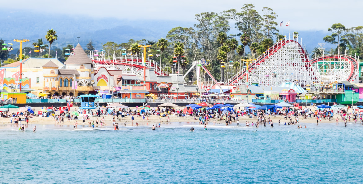 Summer visitors flock to the Santa Cruz Beach Boardwalk on the Fourth of July.