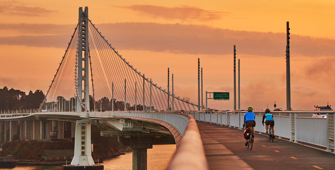 pair of cyclists on the eastern span of the Bay Bridge at sunset, picture