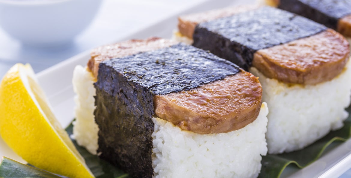 Hawaiian Spam Musubi with a lemon and soy sauce on a plate, image