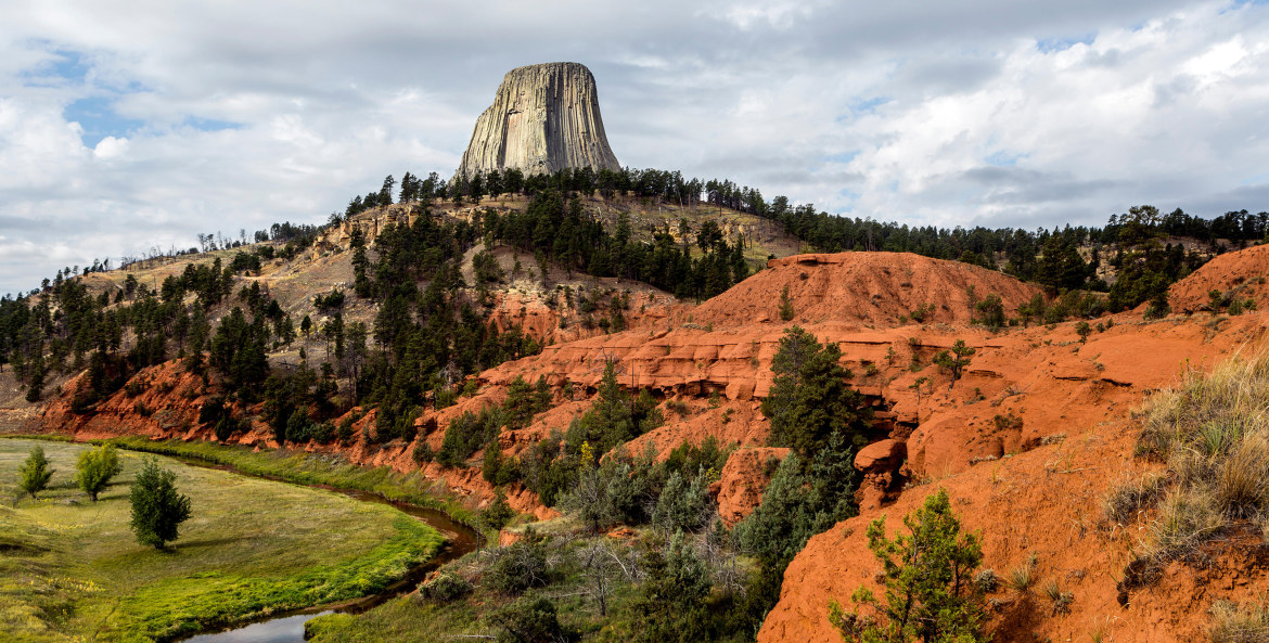 rock monolith looms over Devils Tower National Monument in Wyoming, picture
