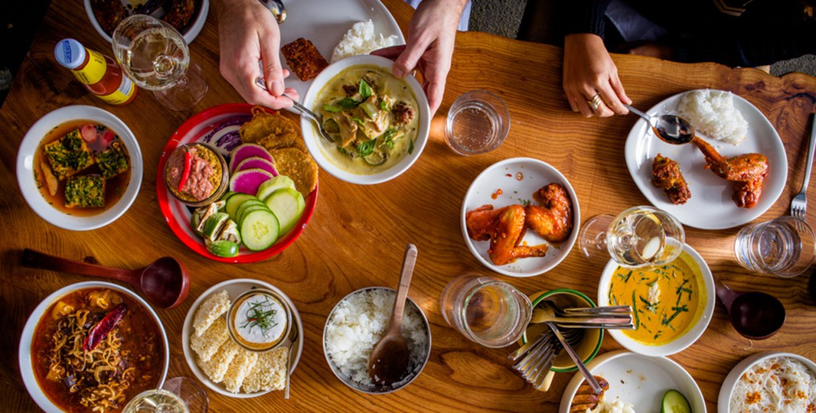 an overhead view of Thai dishes at kin khao, San Francisco