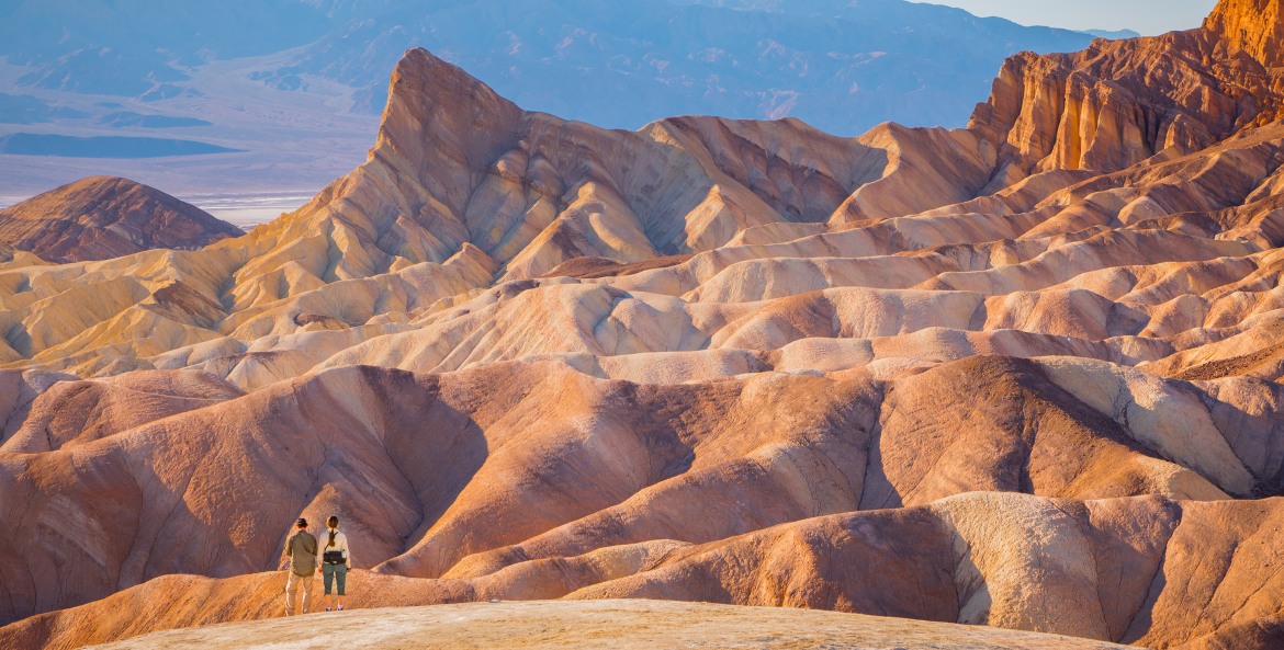 two hikers near Zabriskie Point in Death Valley National Park, image
