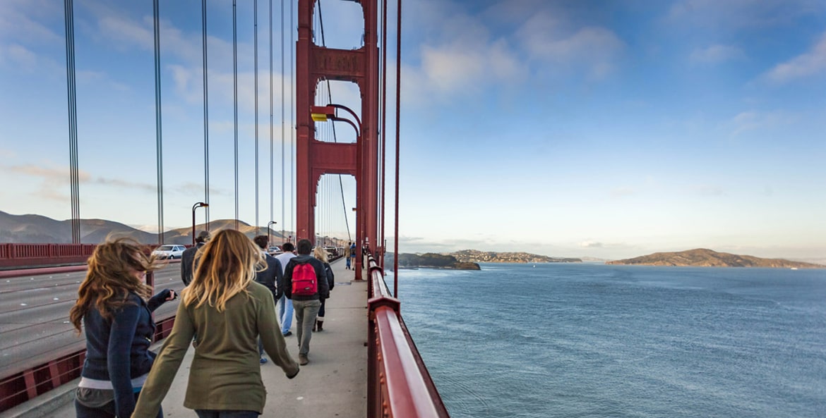 People walking across the Golden Gate Bridge in San Francisco, California, picture