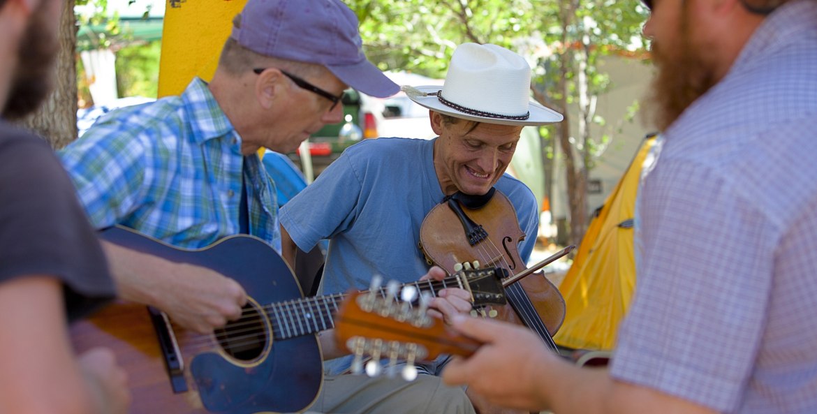 fiddler accompanied by two guitarists outdoors in Weiser, Idaho, picture