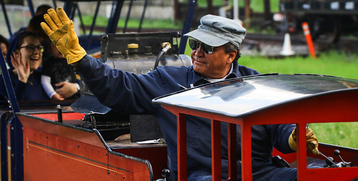 an engineer waves from the Griffith Park and Southern Railroad train, image