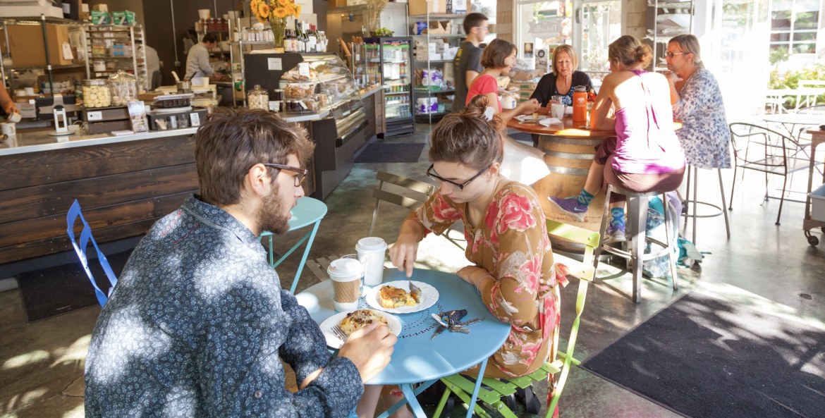various customers seated at tables enjoy breakfast inside Noisette Pastry Kitchen in Eugene, Oregon, picture