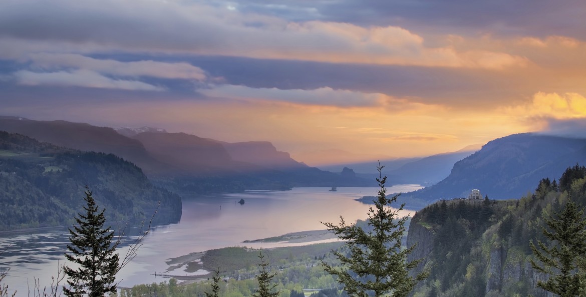 Columbia River Gorge with an orange hued sunset, picture