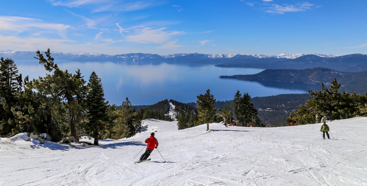 AAA Members ski with views of Lake Tahoe.