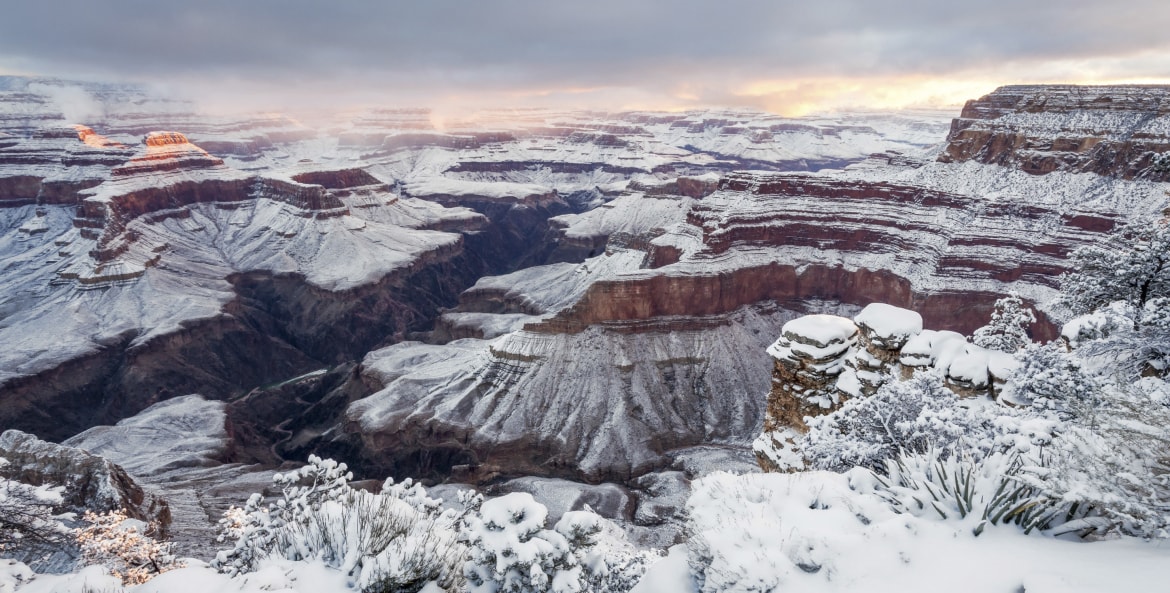 South Rim sunrise panorama with snow from Pima Point at Grand Canyon National Park, Arizona