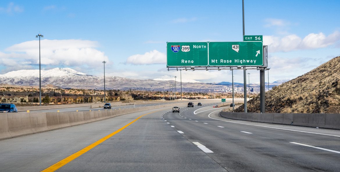 Cars drive on the highway towards Reno, Nevada.