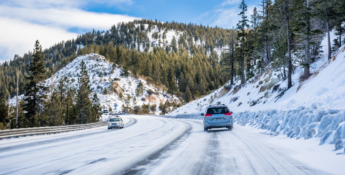 Cars drive on the highway in the Sierra Nevada.