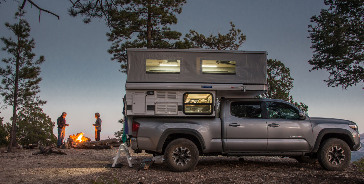 A couple truck camping in Kaibab National Forest.
