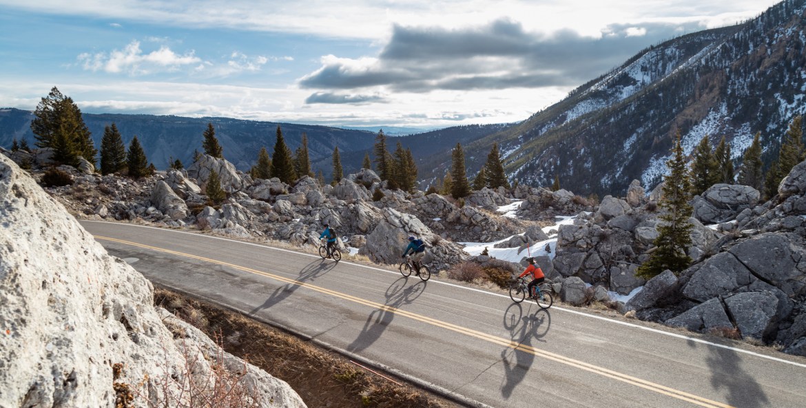 Three cyclists ride among the Hoodoos in Yellowstone National Park.