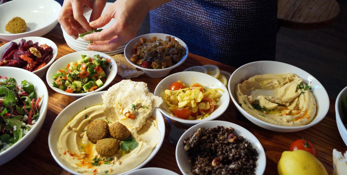 small dishes including pita and olives at Ba-Bite's Middle Eastern restaurant in Oakland picture