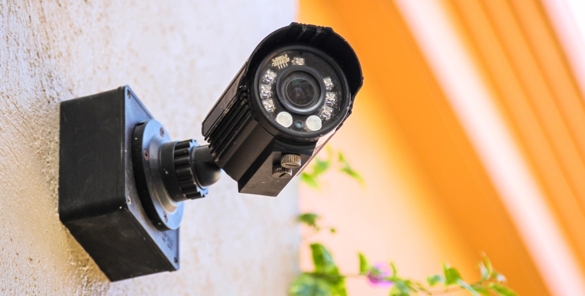 An outdoor camera installed on an exterior house wall.
