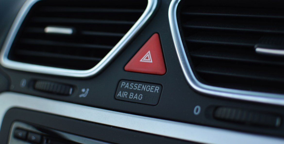 Airbag warning on a vehicle dashboard.