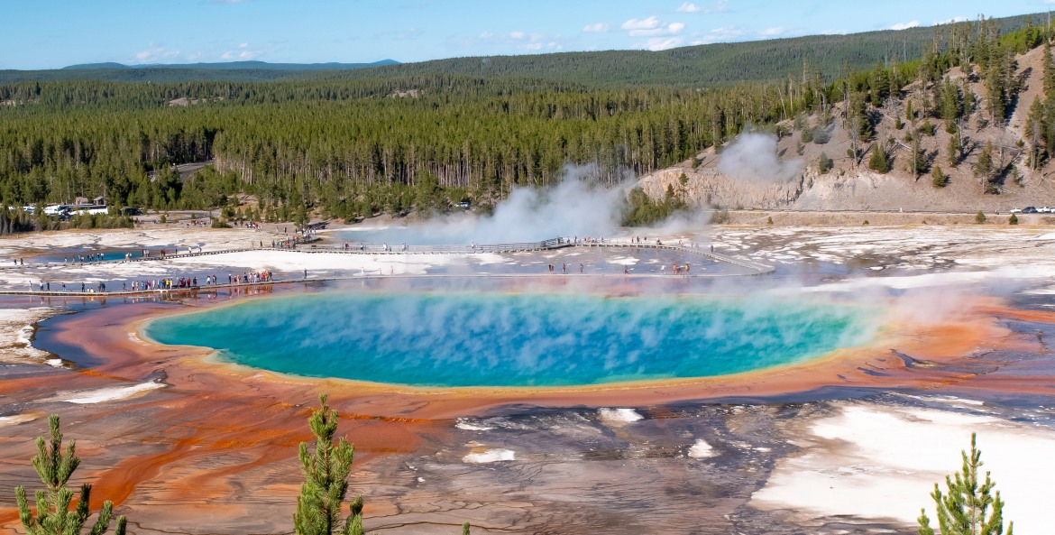 Tourists look at the Grand Prismatic Spring at Yellowstone’s Midway Geyser Basin.