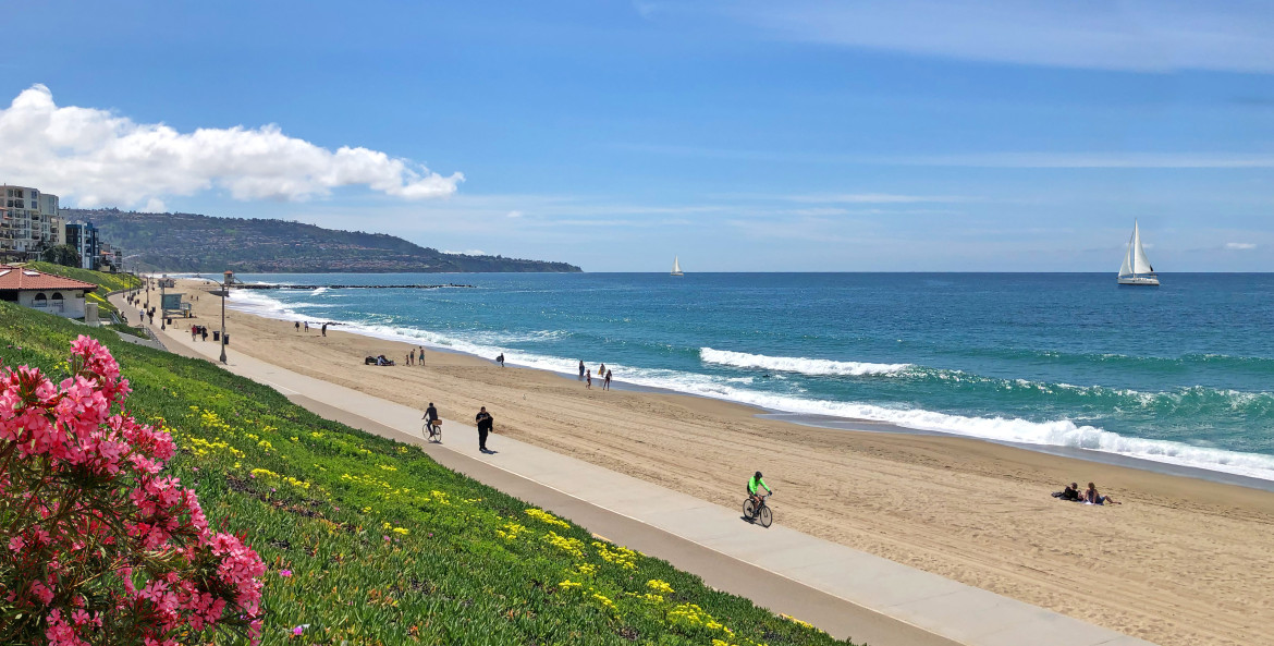 The bike path stretches down Redondo Beach on a Sunny Day.