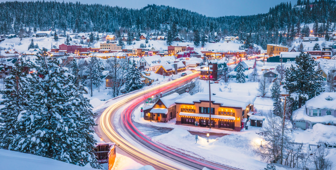 Aerial view of Truckee, California covered in snow at dusk.