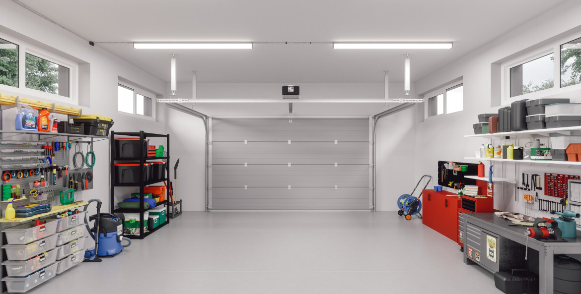 An organized garage with shelving and tools inside.