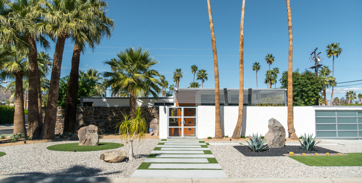 A mid-century modern home in Palm Springs, California on a sunny day.