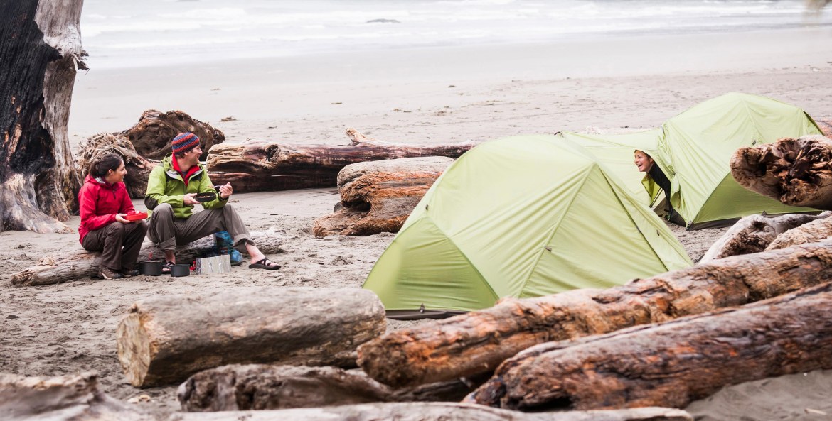 A group of friends camp on Second Beach in Olympic National Park, Washington.