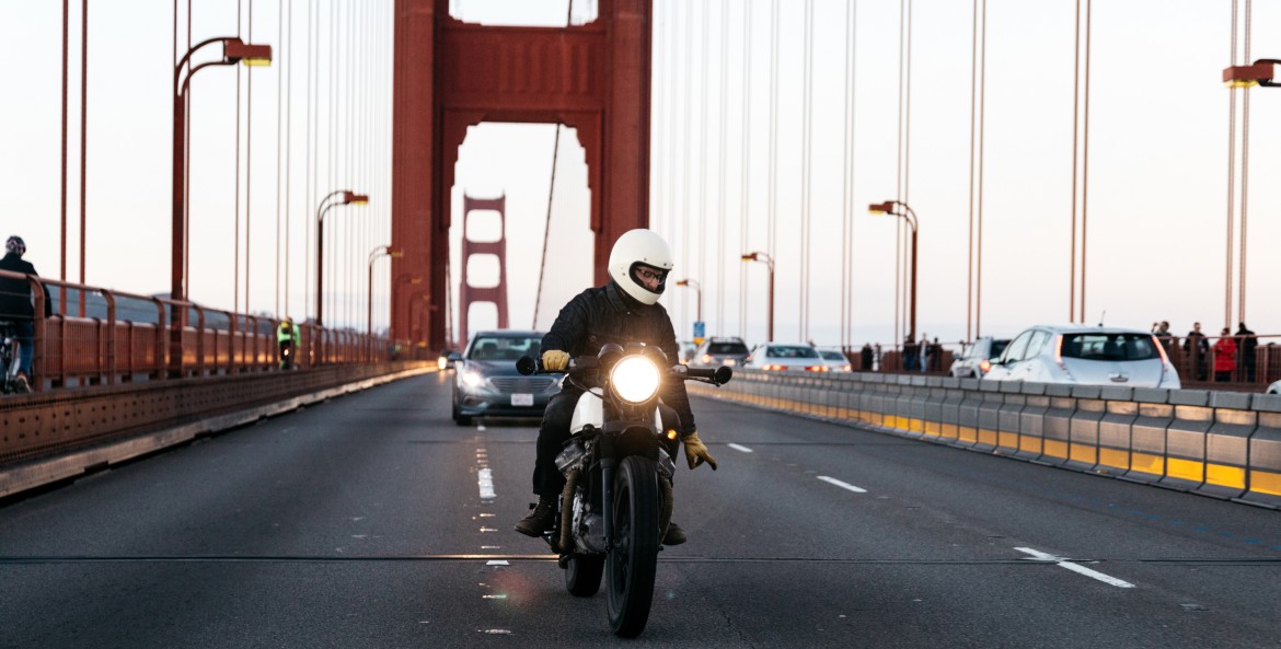 A motorcycle rider changes lanes on the Golden Gate Bridge in San Francisco.