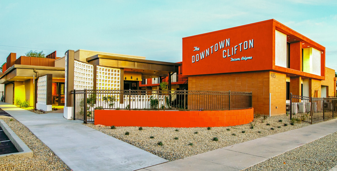 The bright orange facade of the Downtown Clifton Hotel in Tucson.