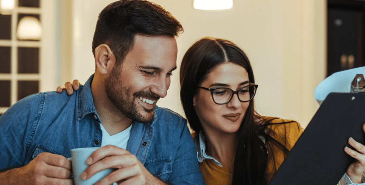 Couple looking at clipboard