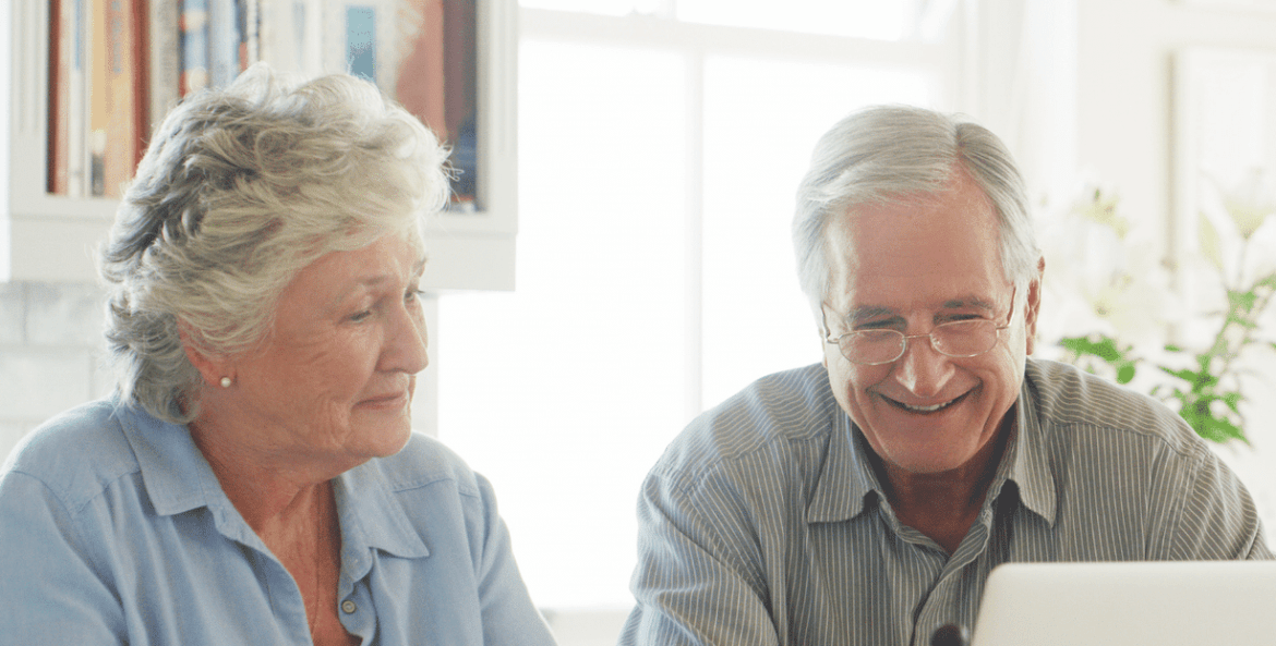 Older couple looking at computer