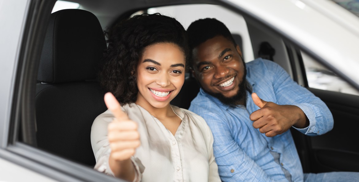 Couple in new car