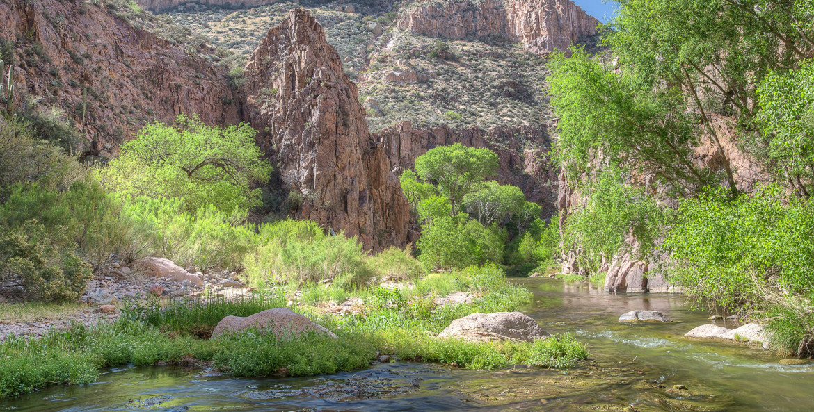 The Aravaipa Creek flows down the 11-mile long Aravaipa Canyon surrounded by the Galiuro Mountain range in the Aravaipa Canyon Wilderness near Klondyke, Arizona.