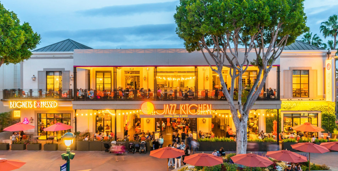 People sit outside the Jazz Kitchen Coastal Grill & Patio in Downtown Disney District.