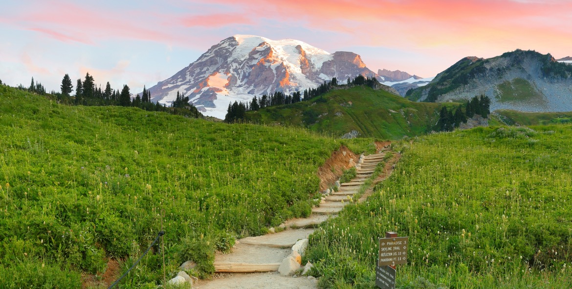 Golden Gate Trail trailhead in the Paradise area of Mt. Rainier National Park at sunset with the mountain in the background.