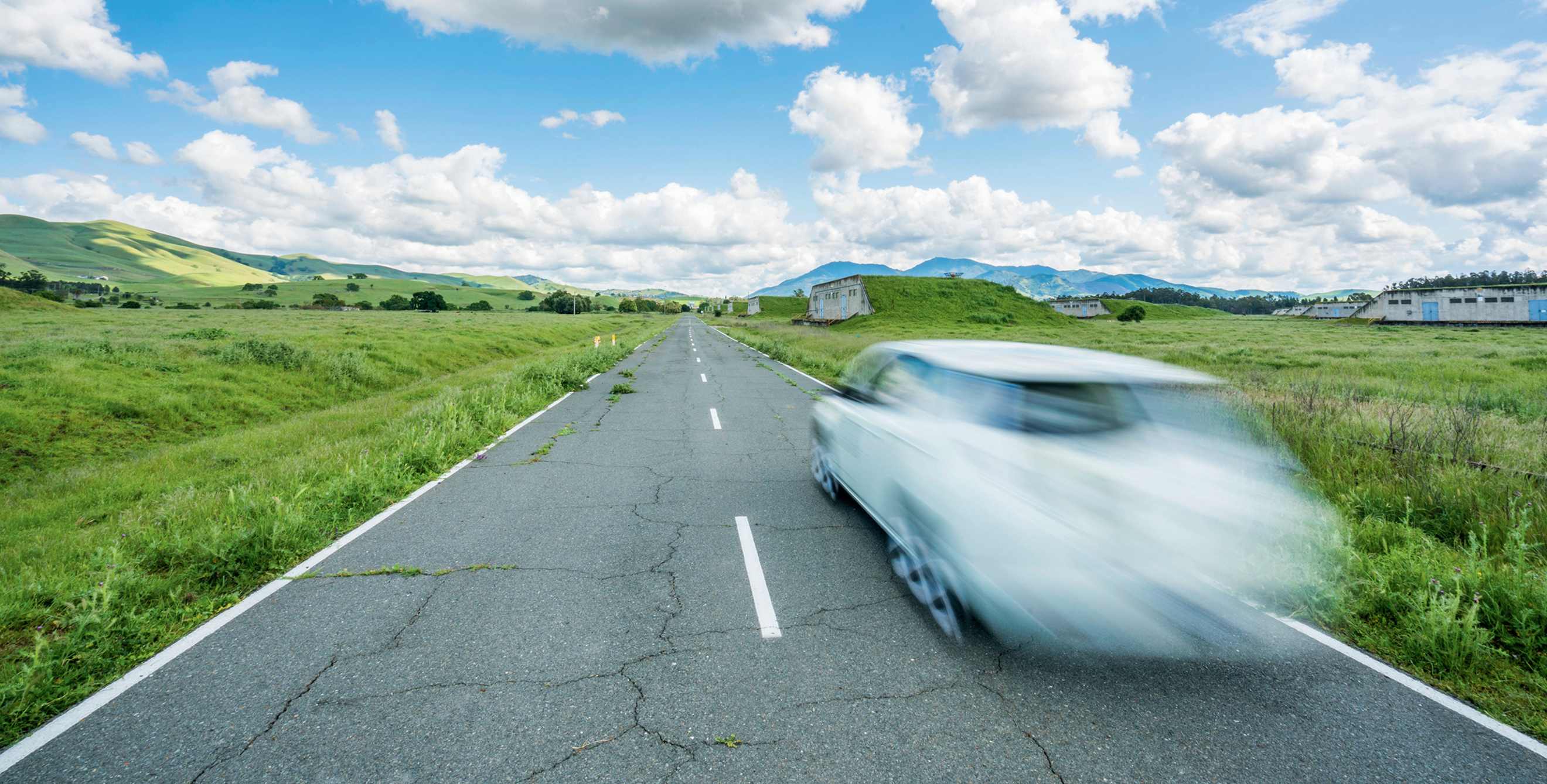 A self-driving car drives on the road at GoMentum Station in Concord, CA, image