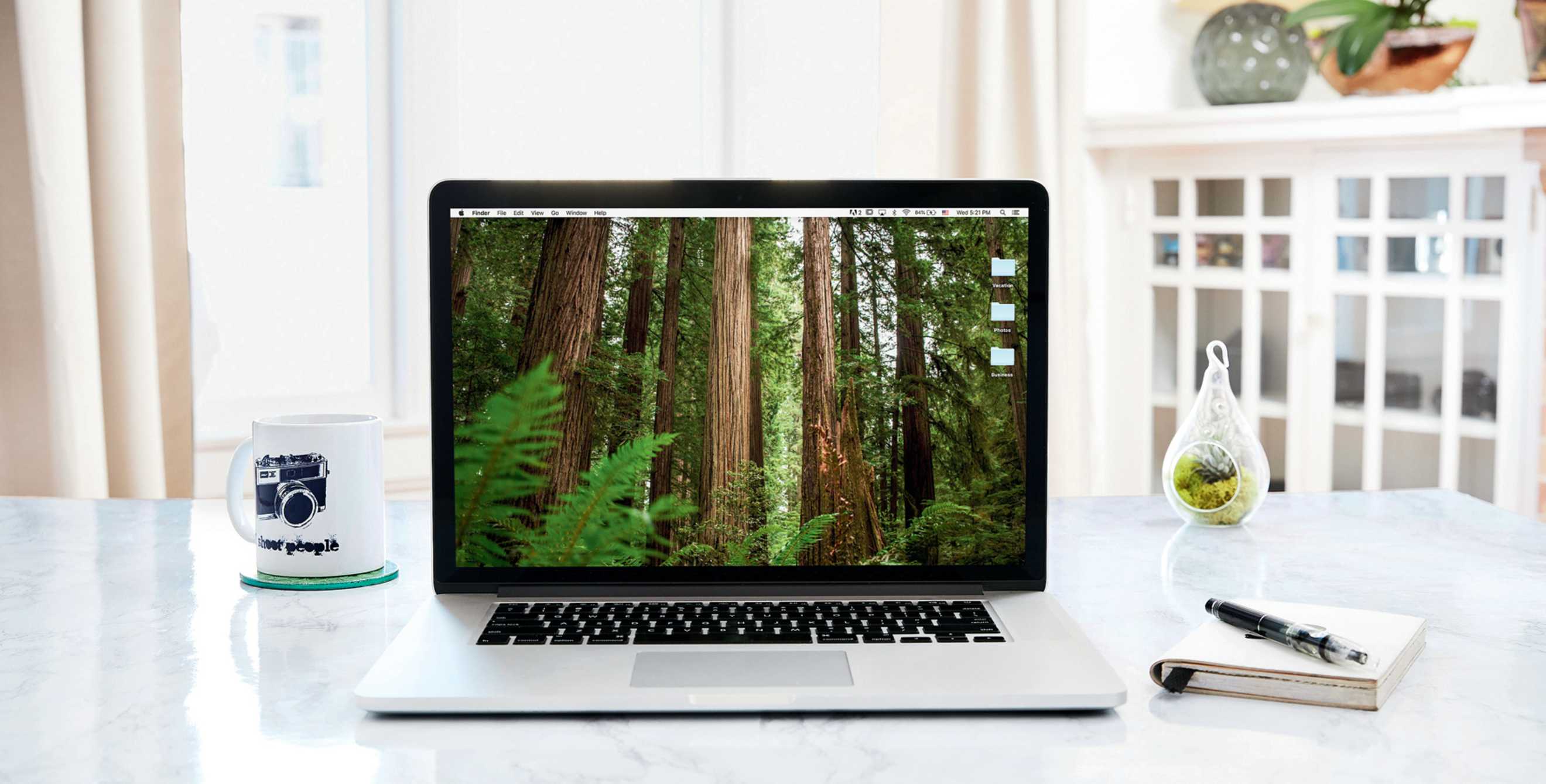 laptop on a clean, minimalist, organized white desk