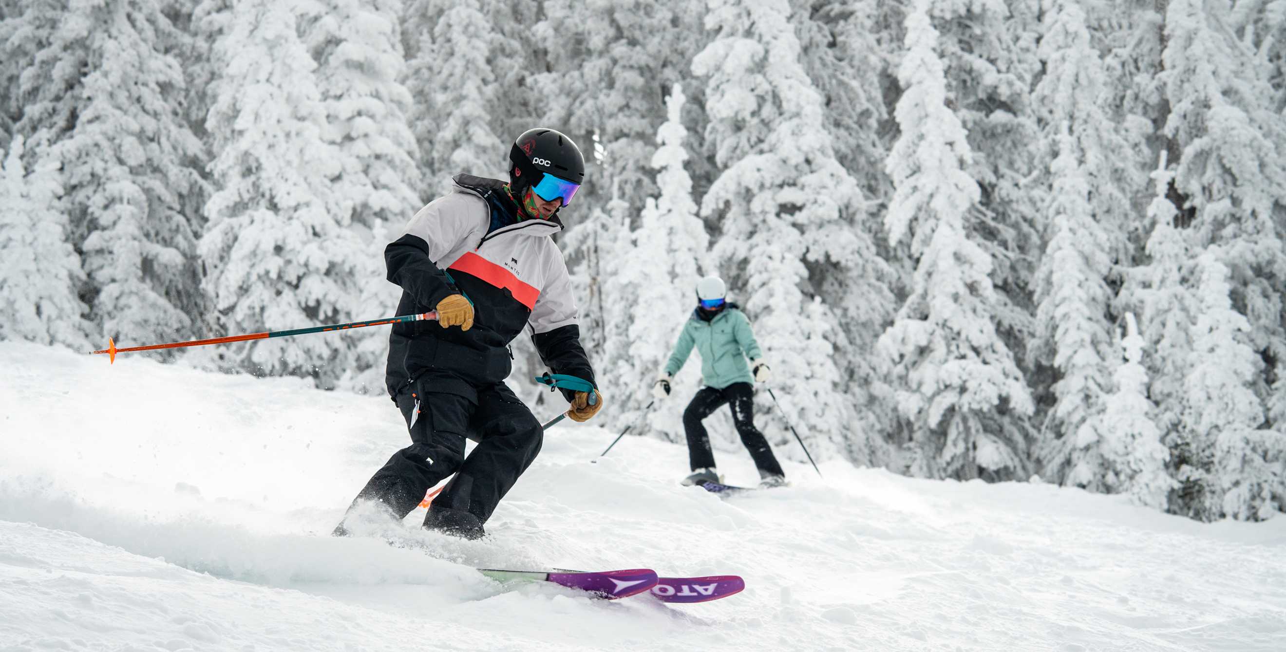 Skiiers fly down the hill at Arizona Snowbowl in Flaggstaff.