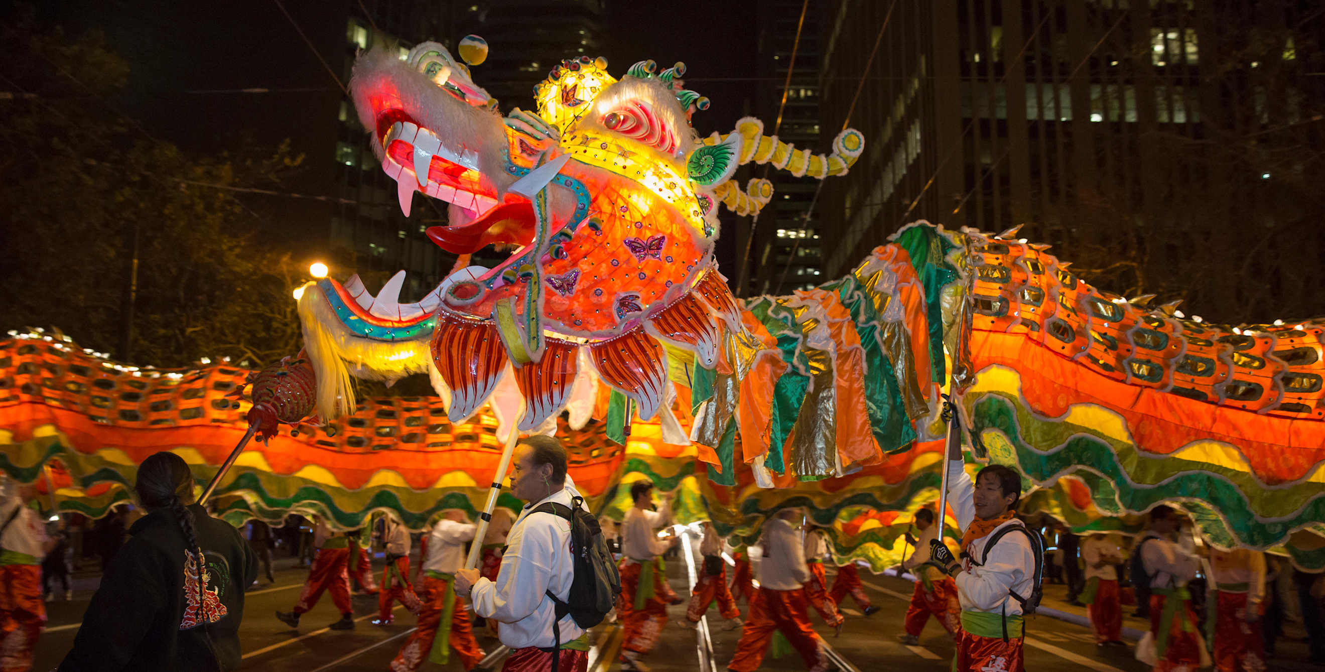 dragon with escorts in Chinese New Year parade at night in San Francisco