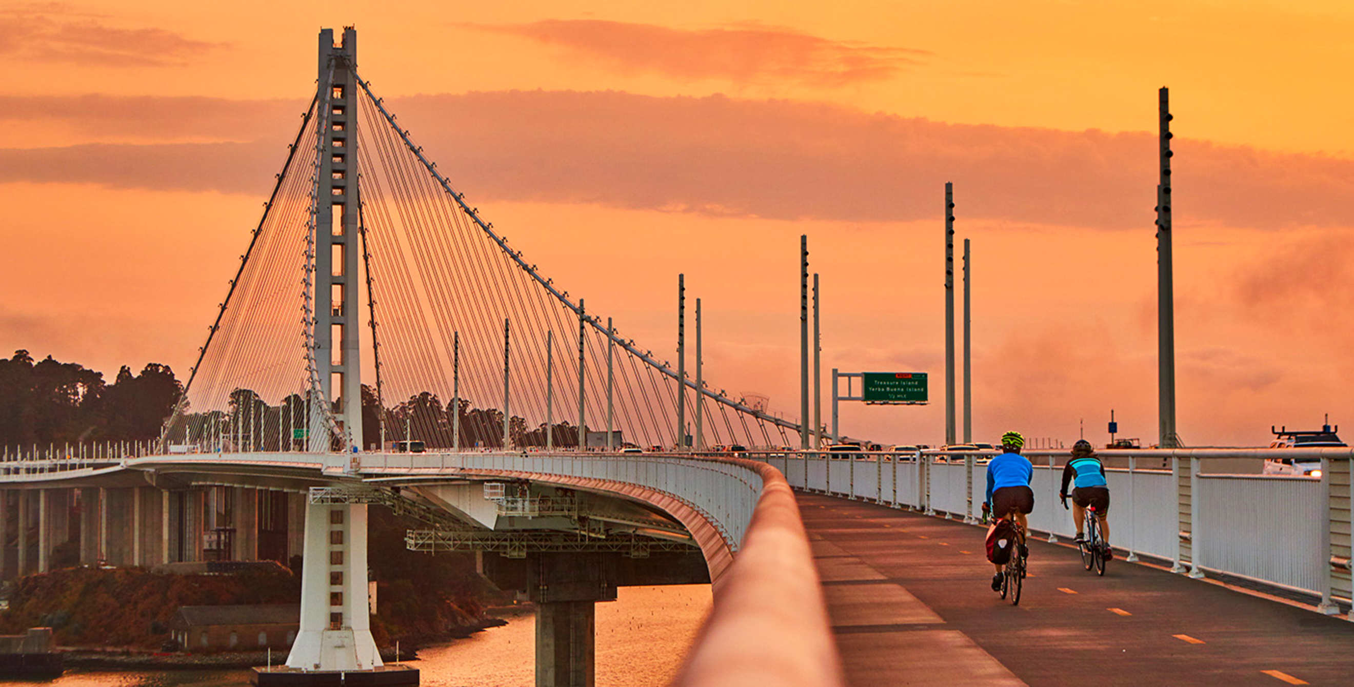 pair of cyclists on the eastern span of the Bay Bridge at sunset, picture