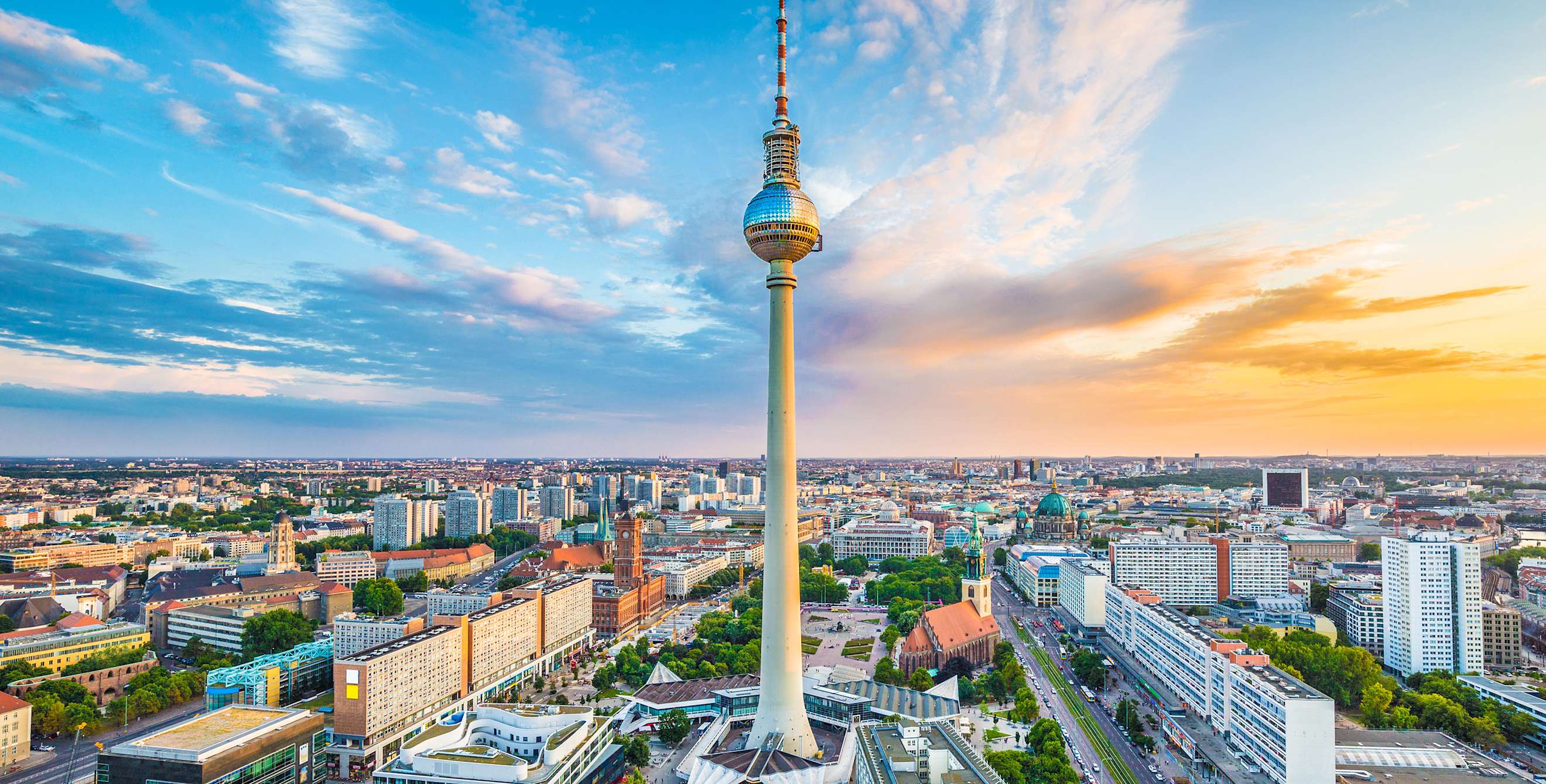 Berlin TV Tower with city panorama at sunset in Berlin, Germany