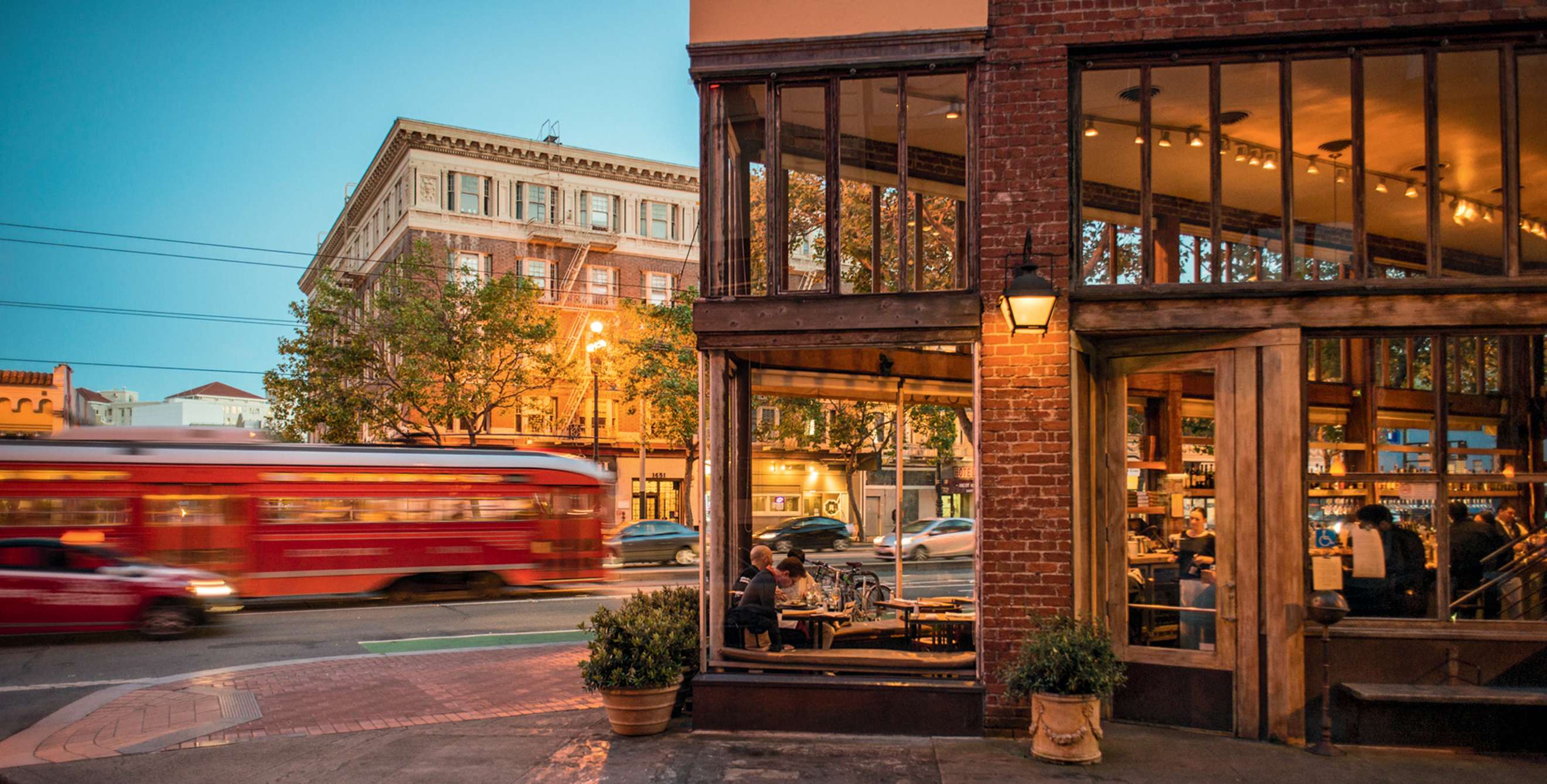 Zuni Café entrance with streetcar in background at dusk in San Francisco, picture