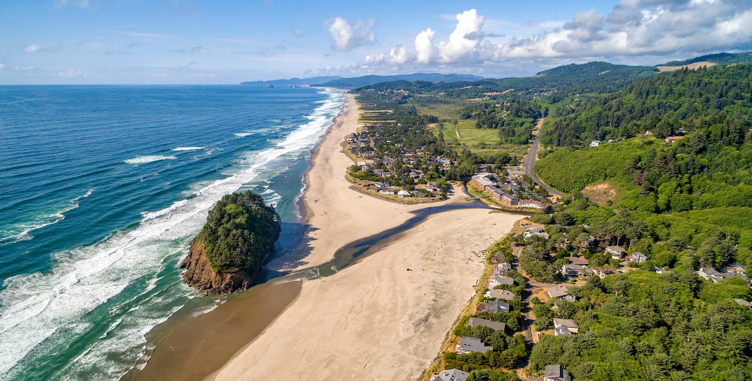 Neskowin, Oregon, from above with coastline view looking north on sunny, partly cloudy afternoon, picture