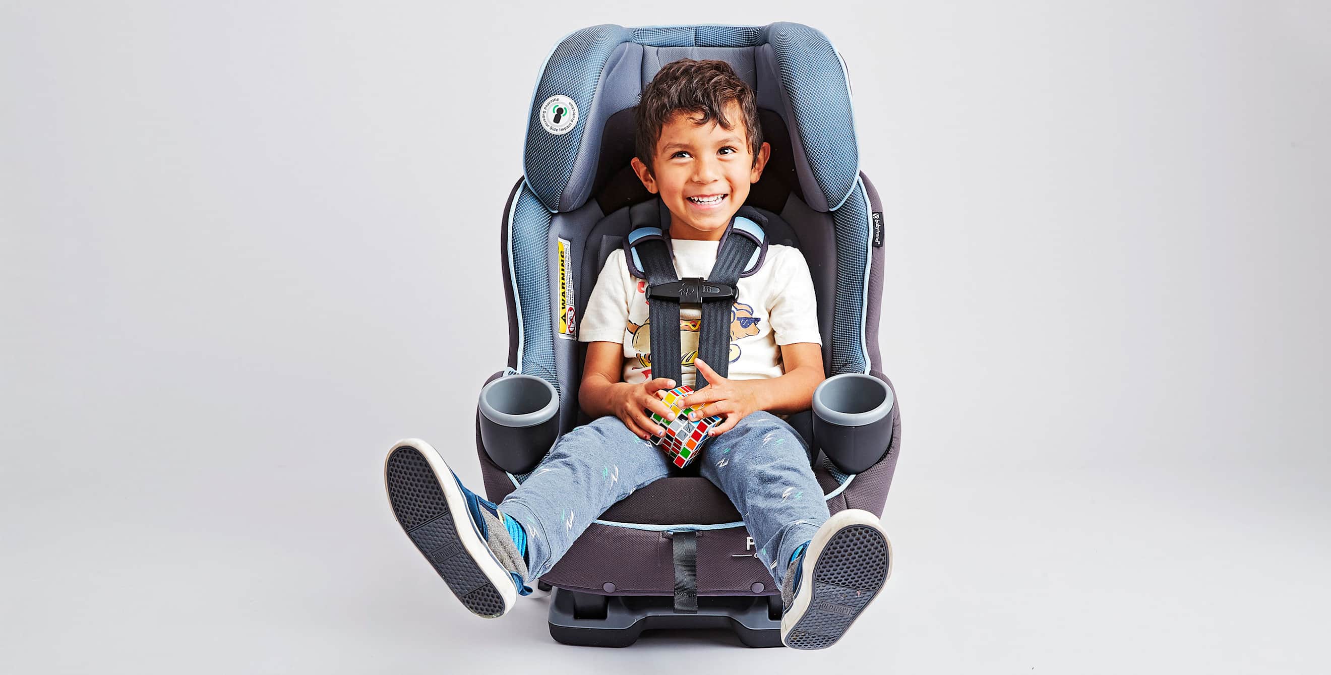 child seated in a blue car seat