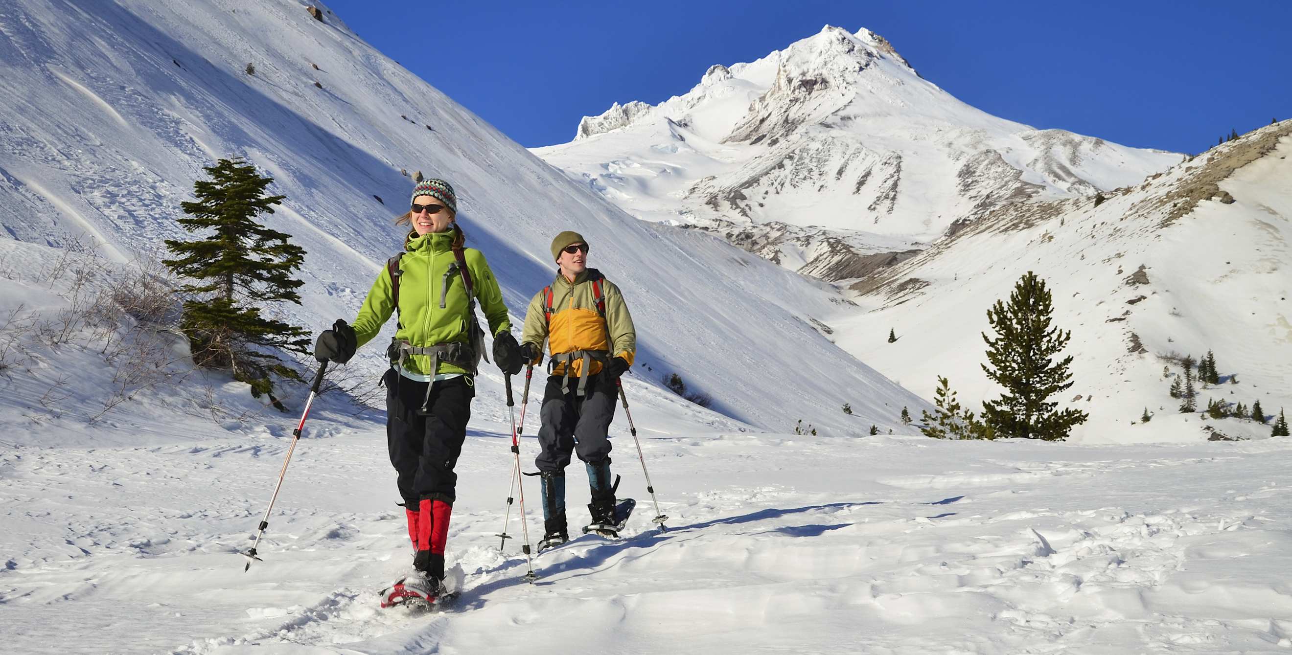 two hikers snow shoe at Mount Hood