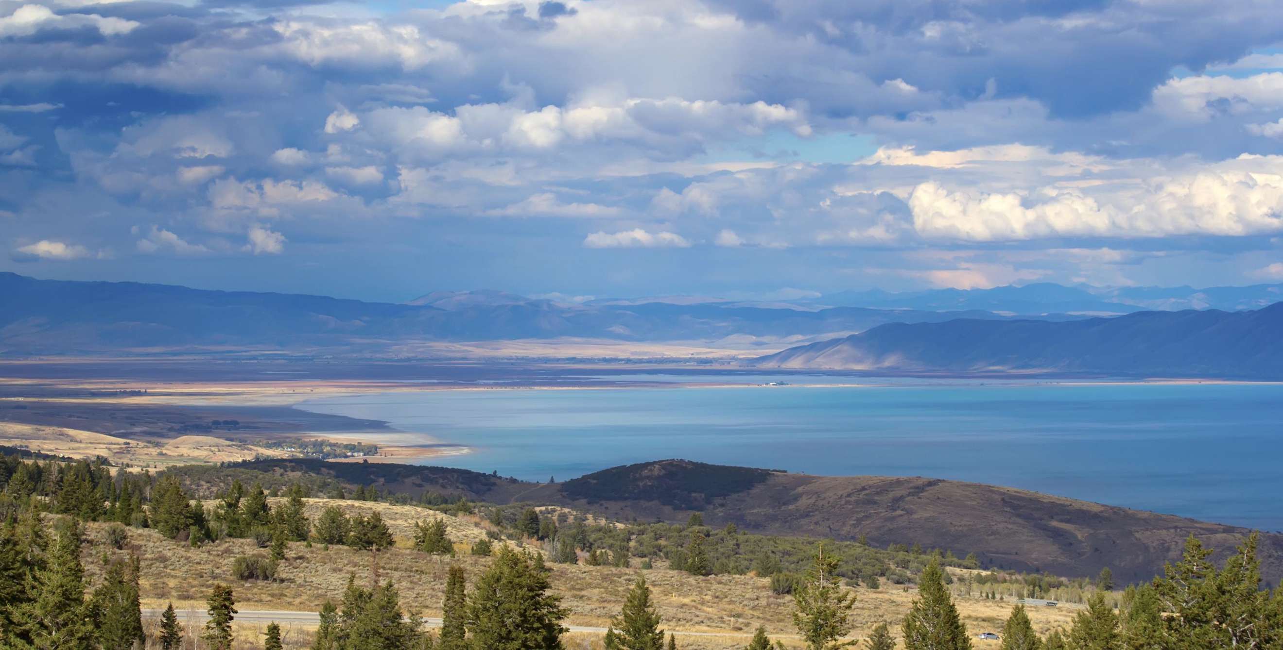 Panoramic of lake and hills in Utah's Bear Lake State Park.