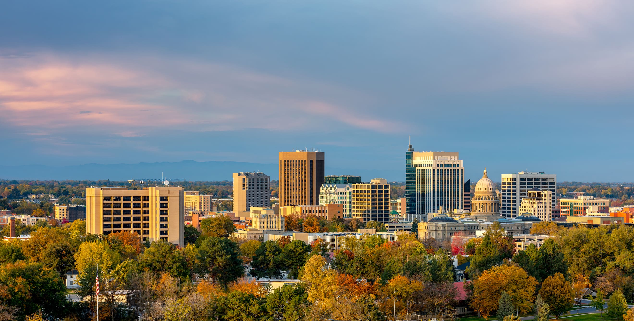 downtown Boise, including state capitol building and surrounding mountains