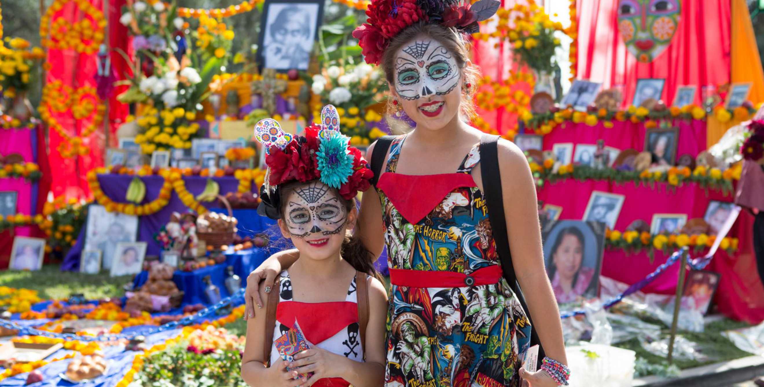 two sisters with decorated faces, image